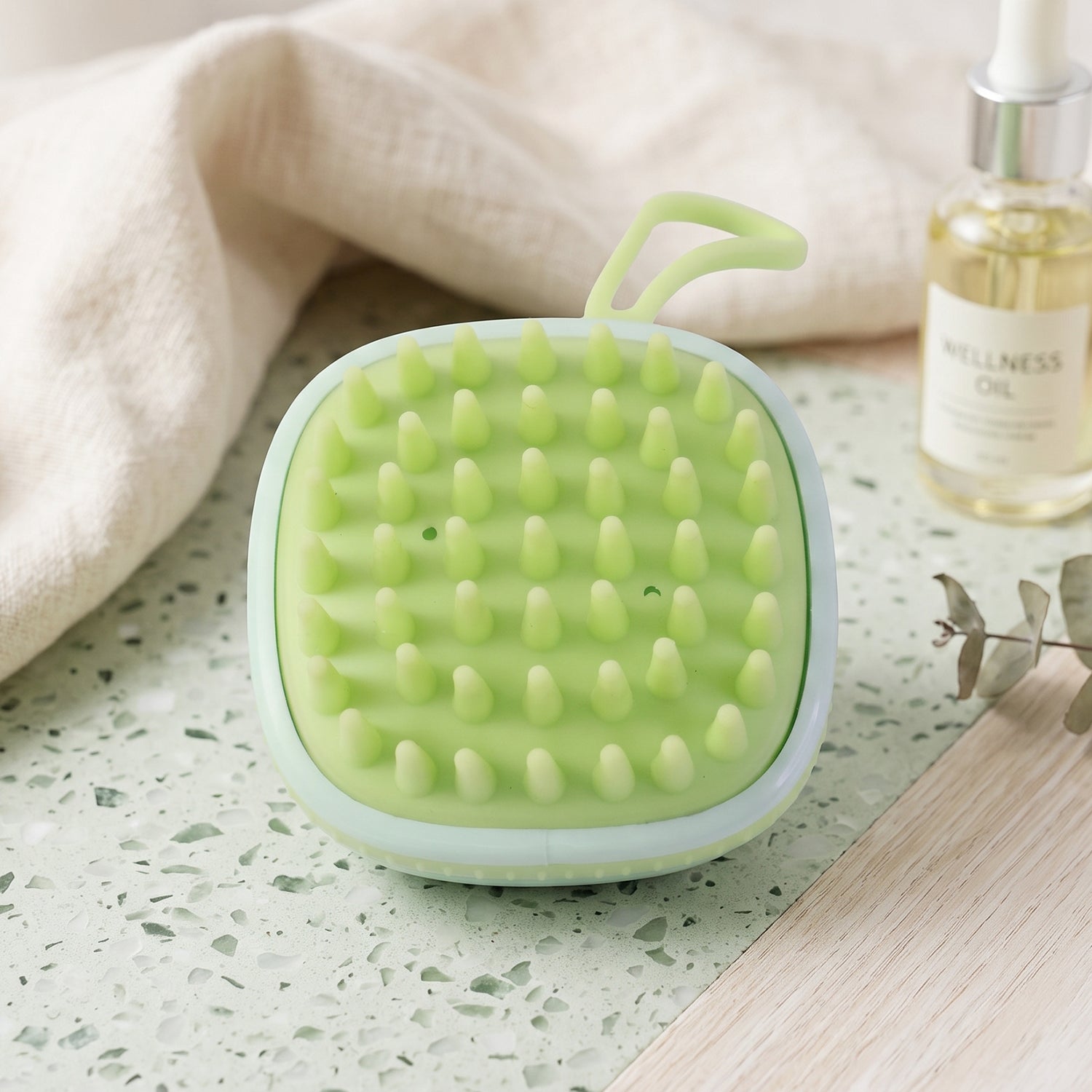 Shampoo brush helps exfoliate and clean the scalp