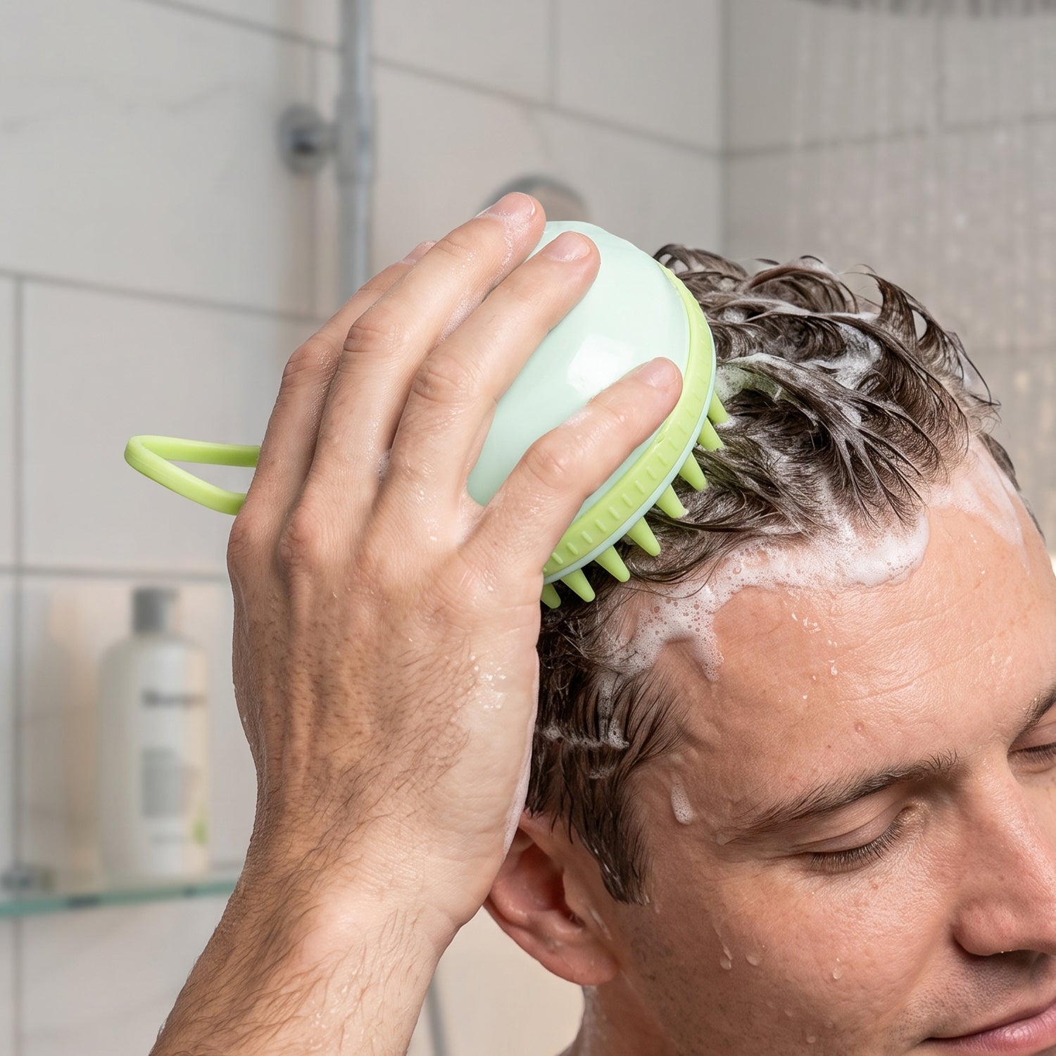 Ergonomic grip scalp massager for shower use