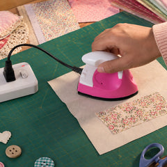 Mini iron carried in a travel bag