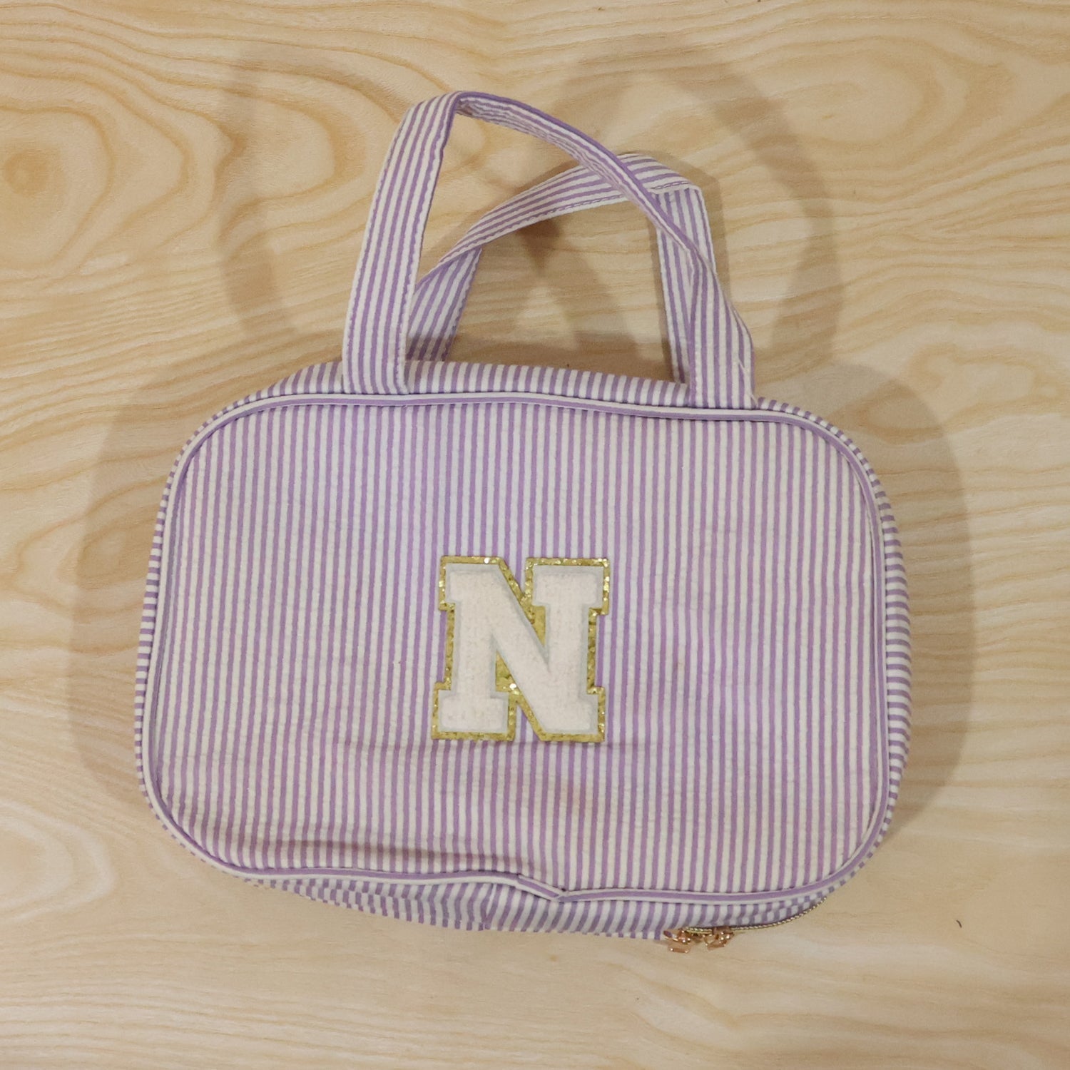 Detailed view of multi-pocket toiletry pouch