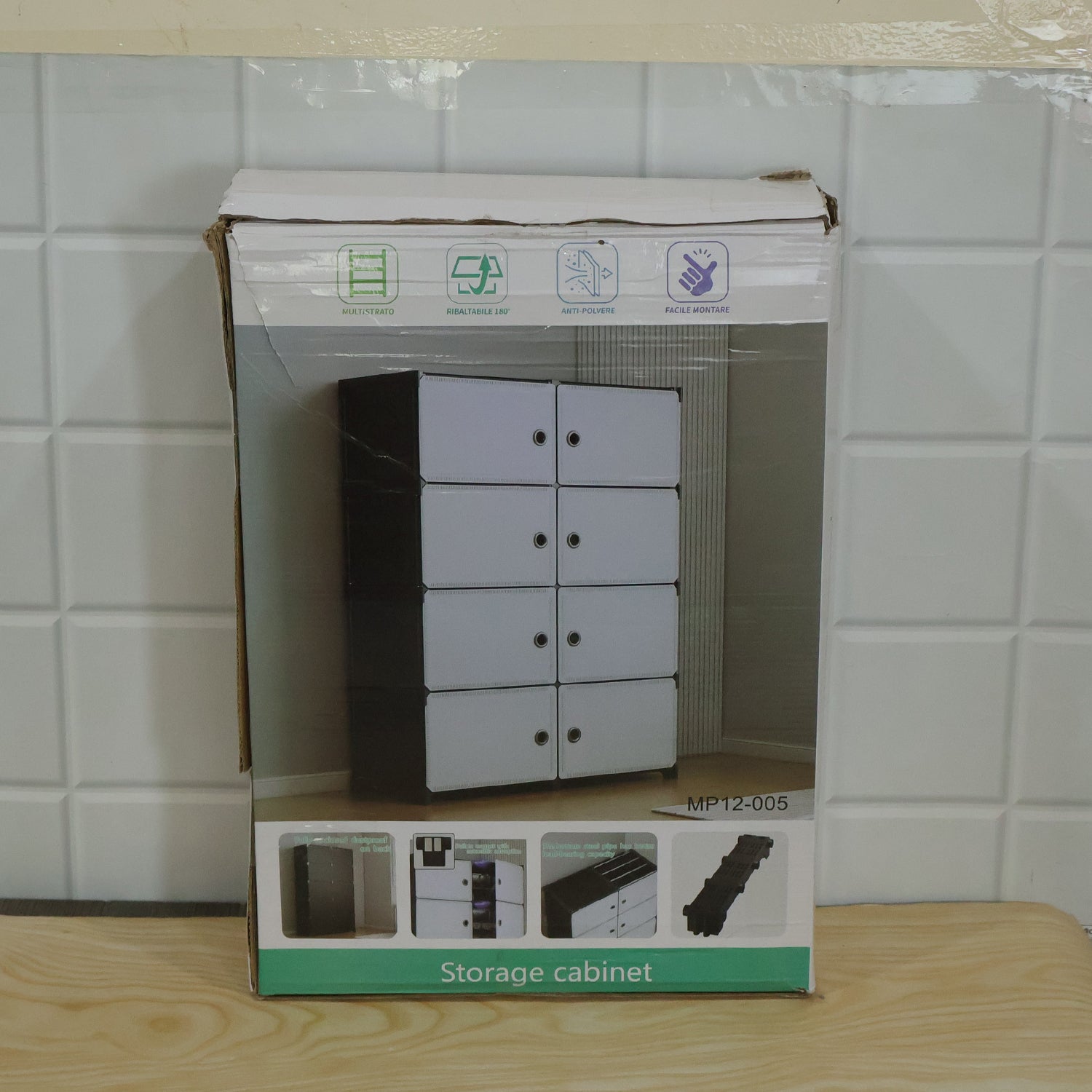 Cardboard box for a storage cabinet, showing an image of the product and assembly instructions.