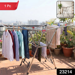 A stainless steel clothes drying rack with clothes, on an outdoor patio, with an inset image of the rack in an indoor