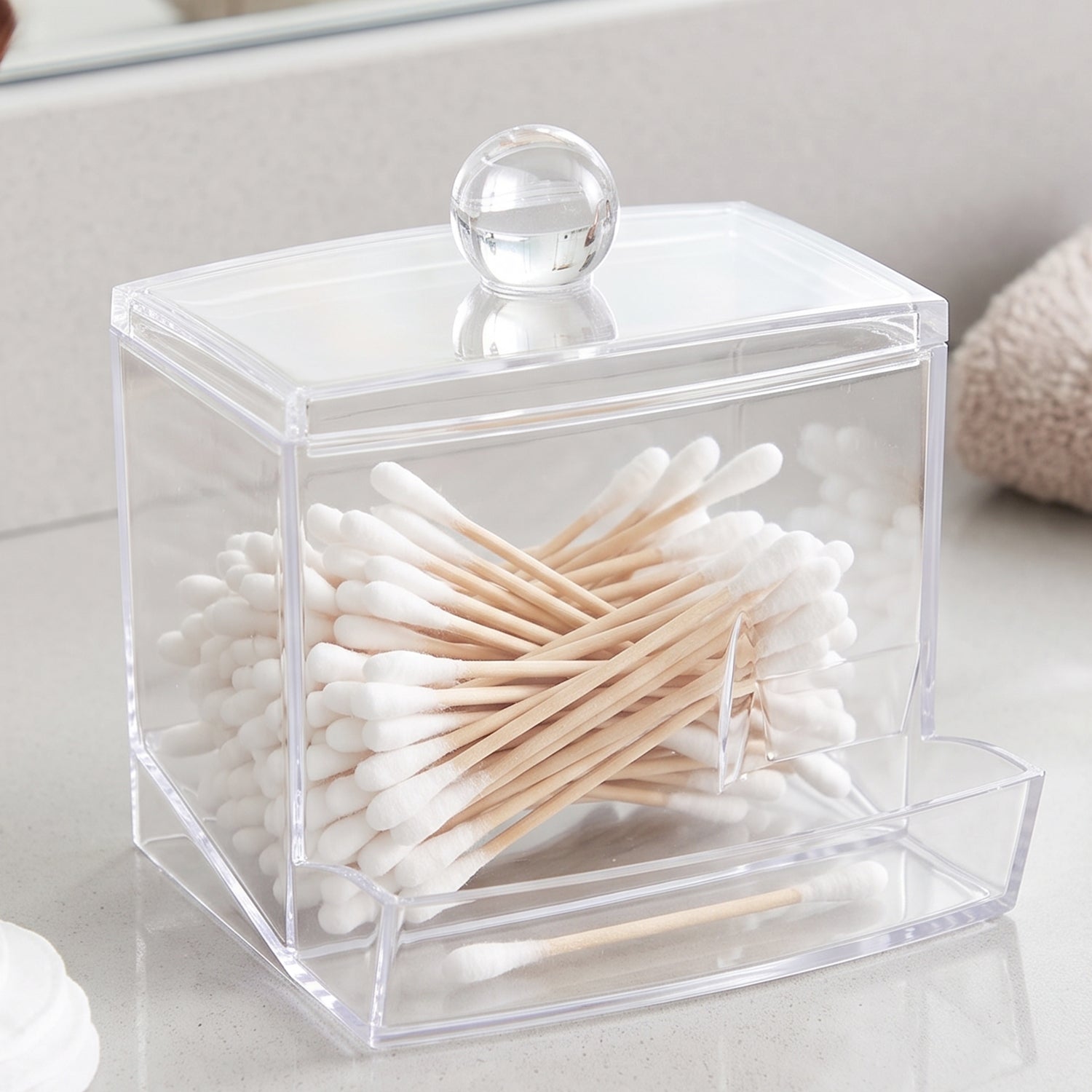 Cotton swab organizer filled with buds and cotton pads