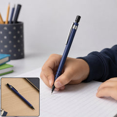 A child's hand writes with a blue mechanical pencil on lined paper, with a smaller inset image of the pencil on a wooden
