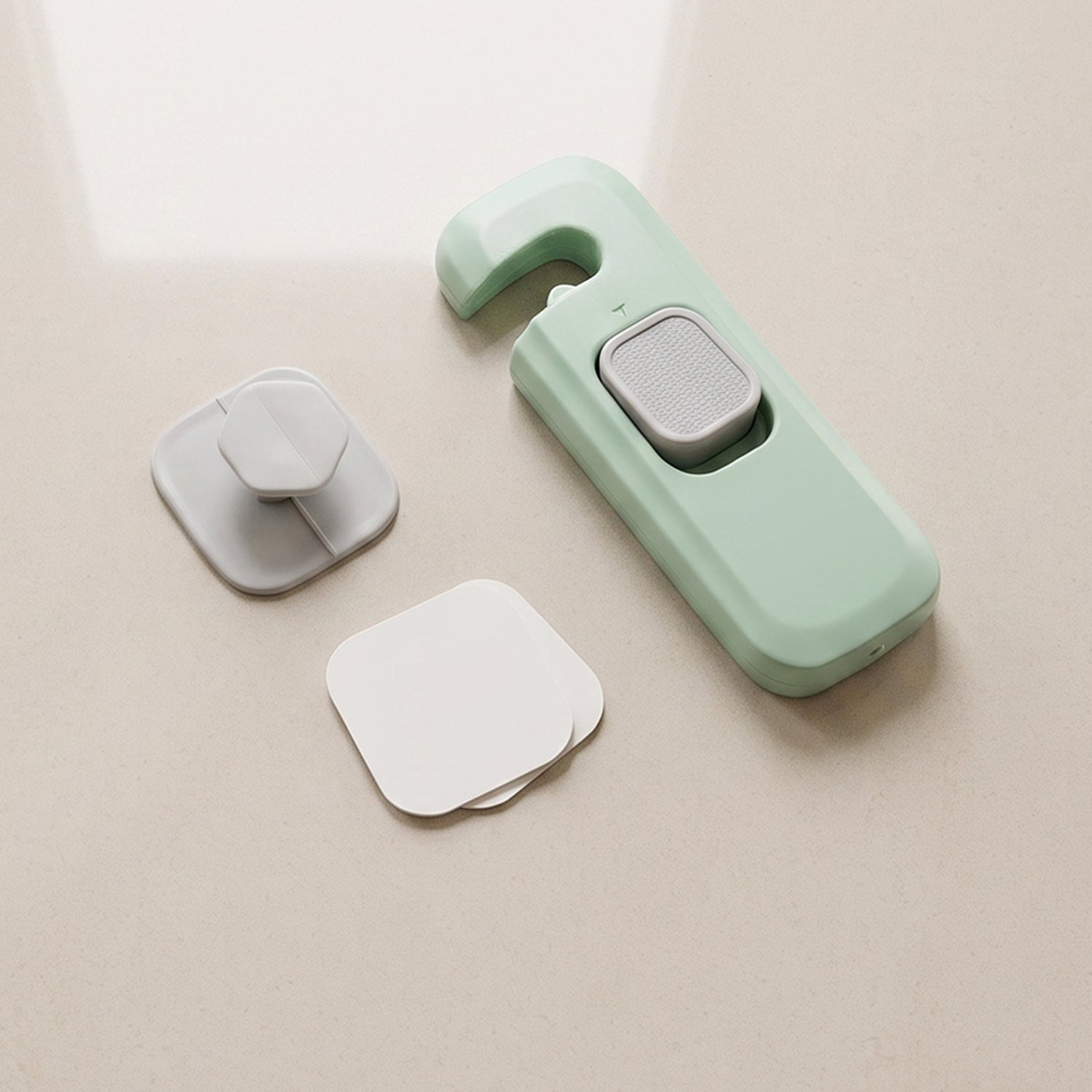 Adhesive child safety lock with mounting bases