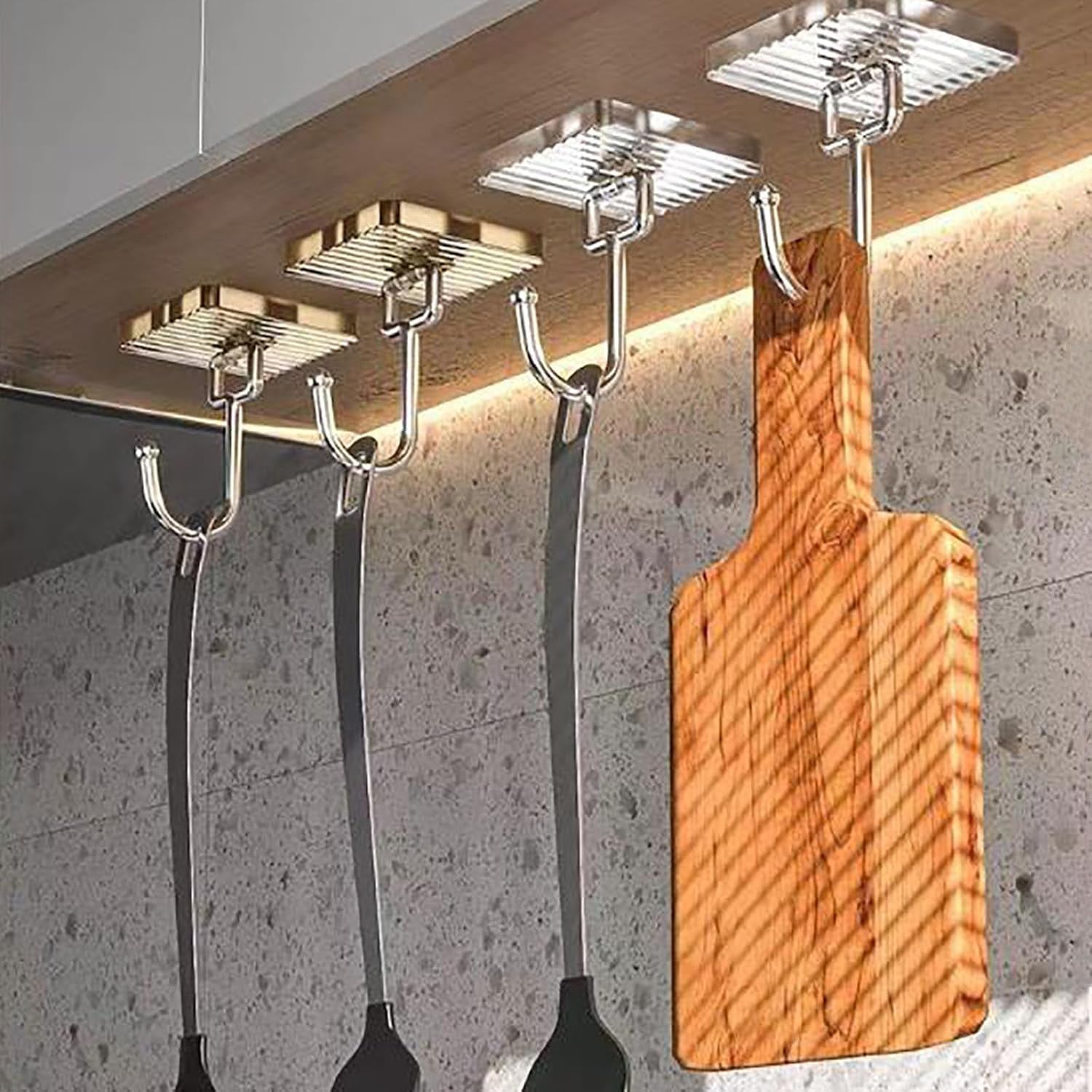 Adhesive hook holding keys and bags