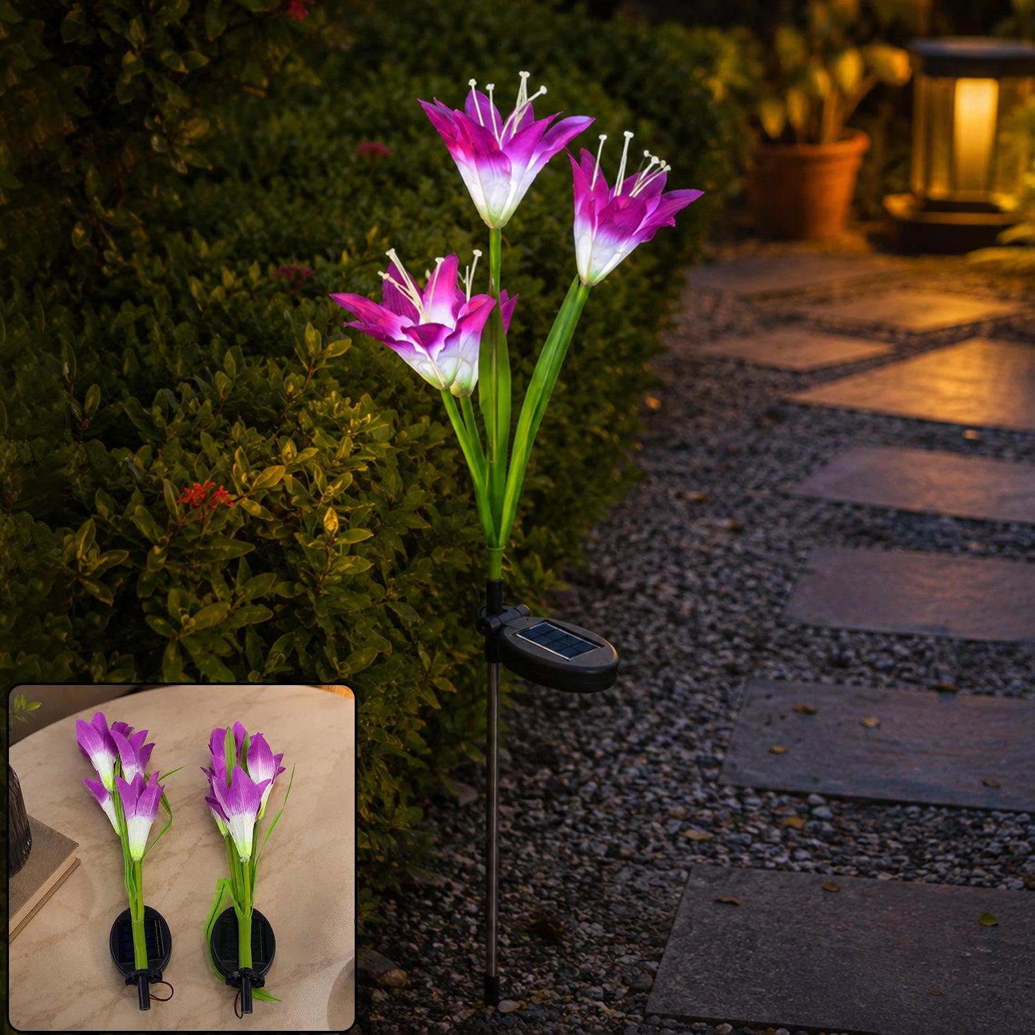 A single purple and white solar flower stake light illuminates a garden pathway at dusk.