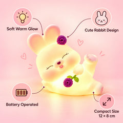 Detailed view of the reclining rabbit night light with floral accents