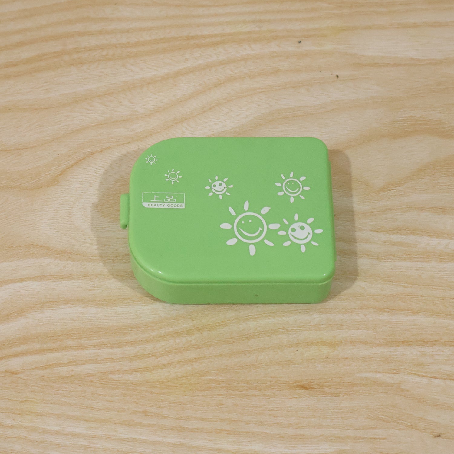 Pill organizer box shown with dimensions for size reference.