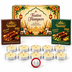A festive hamper box, two boxes of wafer rolls, ten unlit tea light candles, and a silver coin on a white surface.