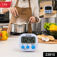 A white digital timer with 00:00 displayed is magnetically attached to a small white cosmetic fridge on a wooden vanity.