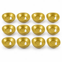 Twelve unlit golden diyas with white plastic wicks are neatly arranged in four rows on a white surface.