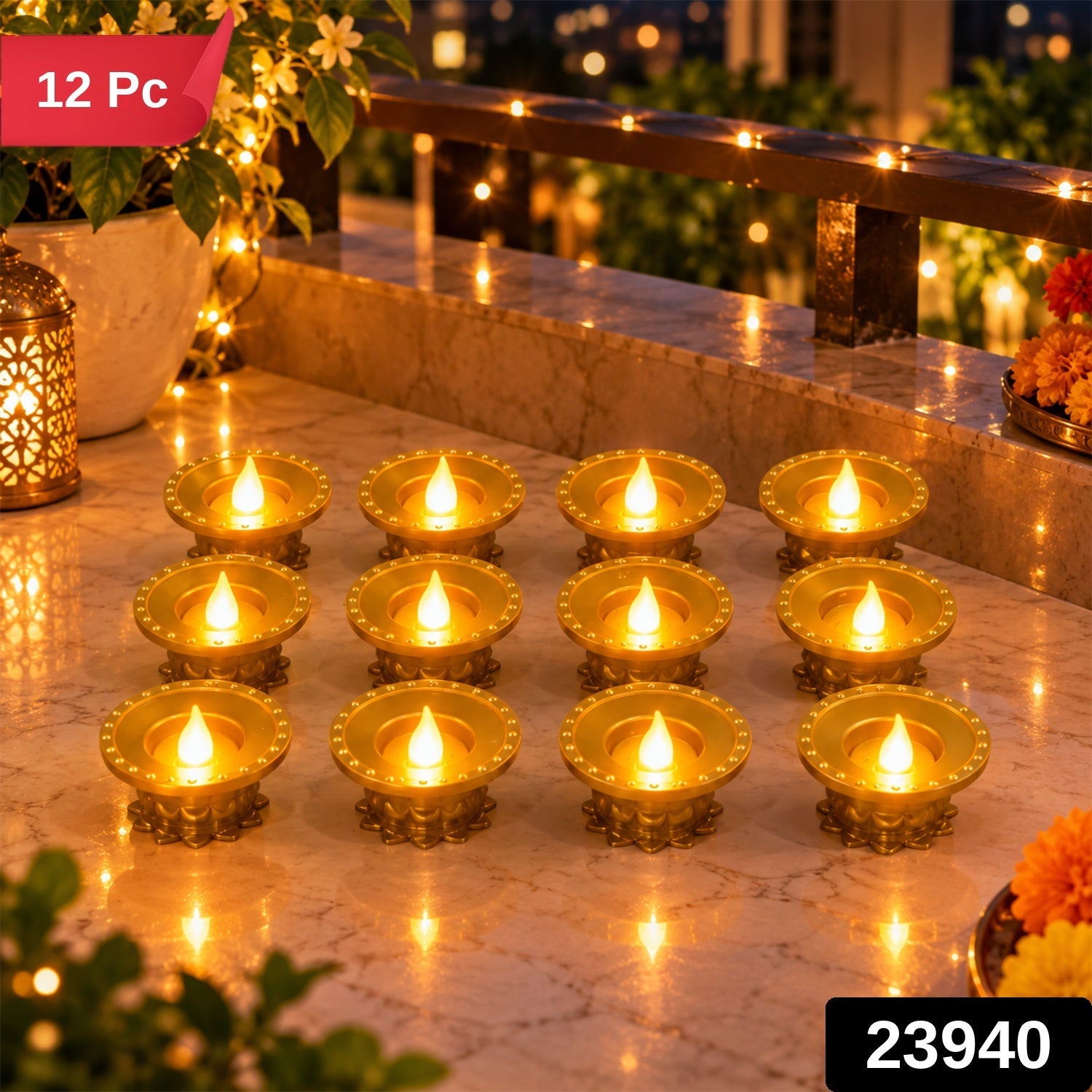 Twelve illuminated gold plastic LED diyas arranged in rows on a balcony ledge at night, with string lights.