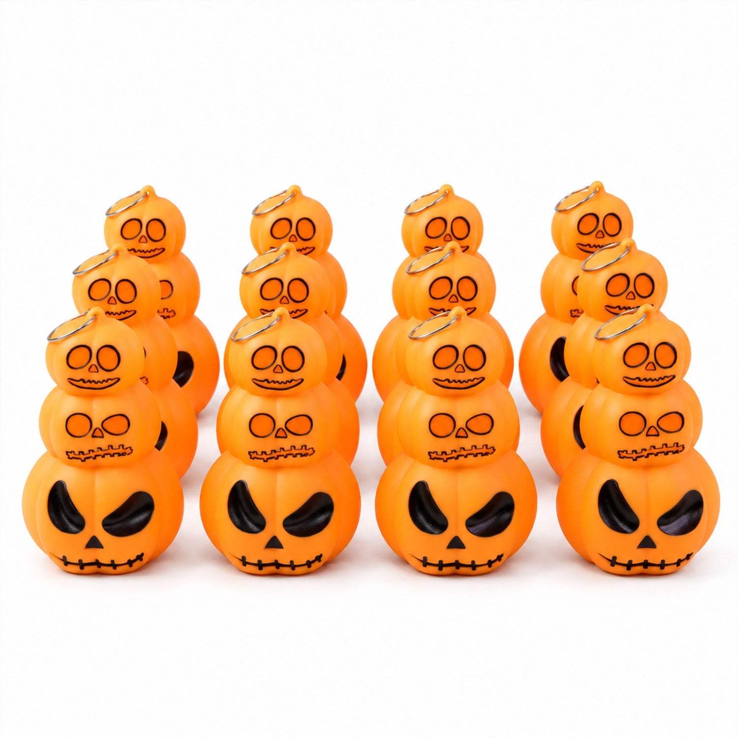 Twelve glowing orange stacked pumpkin lanterns with black facial features are arranged in three rows on a white surface.