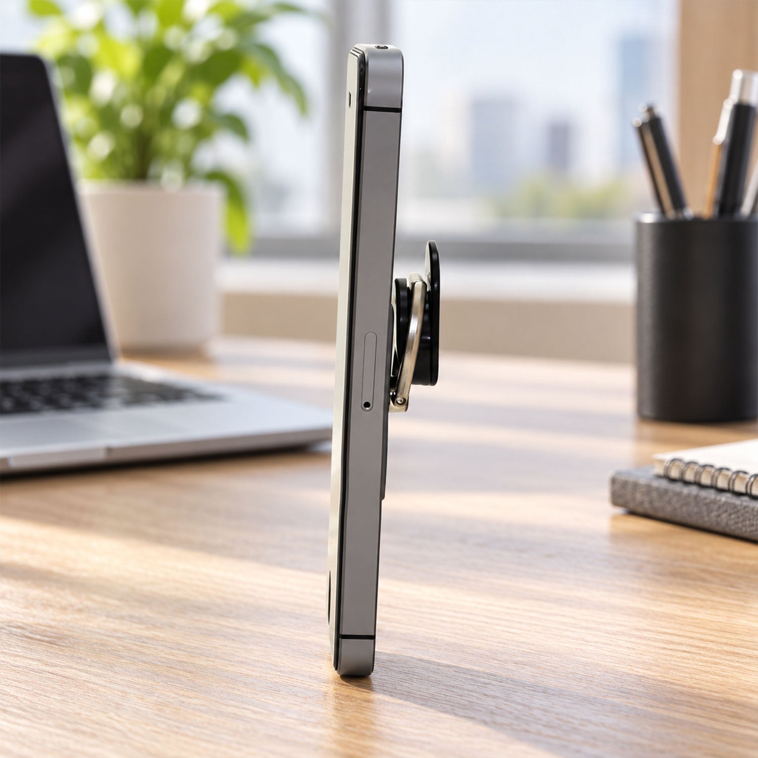 The gray phone ring holder is shown with callouts highlighting its smooth pivot, fold-flat profile, comfort-fit ring, and
