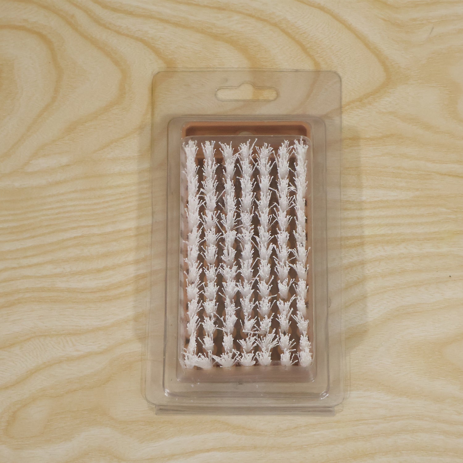 Live photo of cleaning brush in card packing