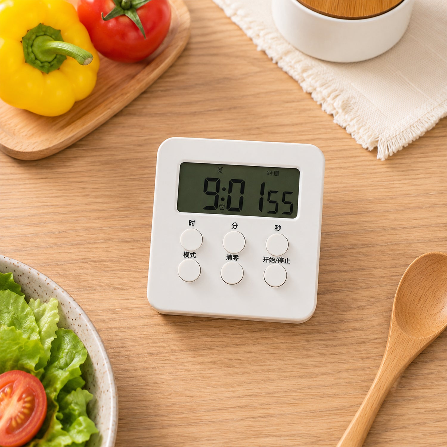 Digital timer placed near kitchen ingredients