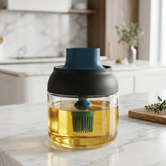 Round glass oil dispenser filled with cooking oil