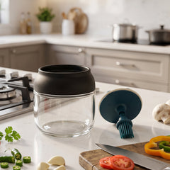 Oil dispenser jar shown with its silicone brush