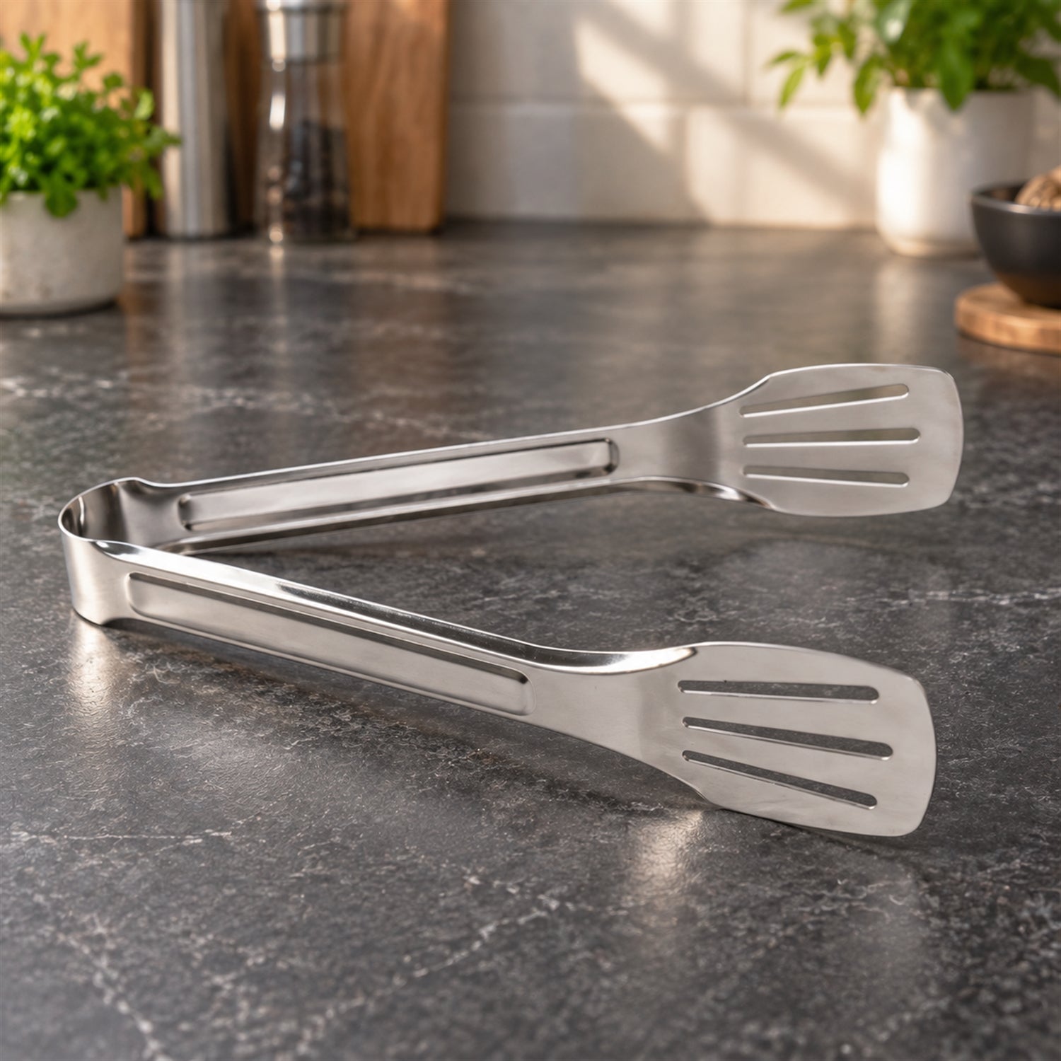 Steel tongs cooking serving food