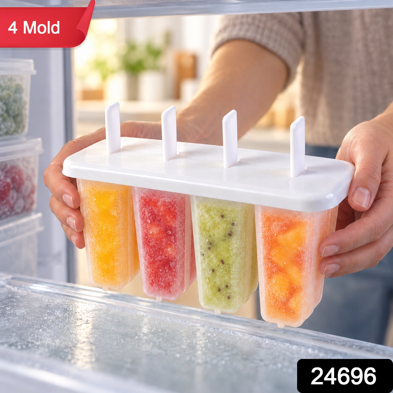 A person holds a white plastic popsicle mold with four colorful fruit popsicles inside a freezer, featuring a red "4 Mold"
