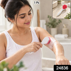 A woman in a white tank top scrubs her arm with a pink and white silicone brush; an inset shows the brush alone.