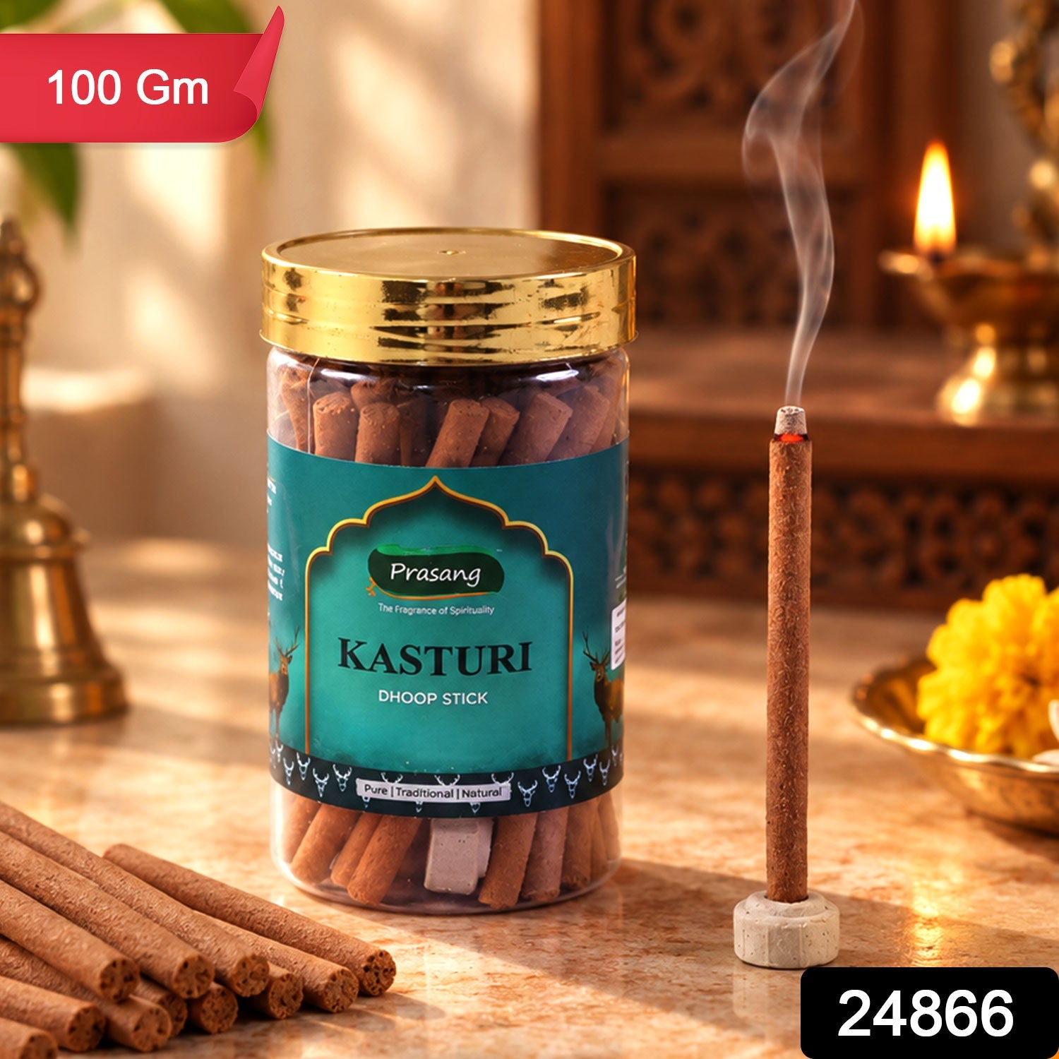 A jar of brown dhoop sticks, one burning in a holder, with a small brass bell and flower offering.