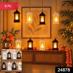 Eight small black and white lanterns with glowing LED candles are arranged on a wooden console table and hanging â€“ view 2