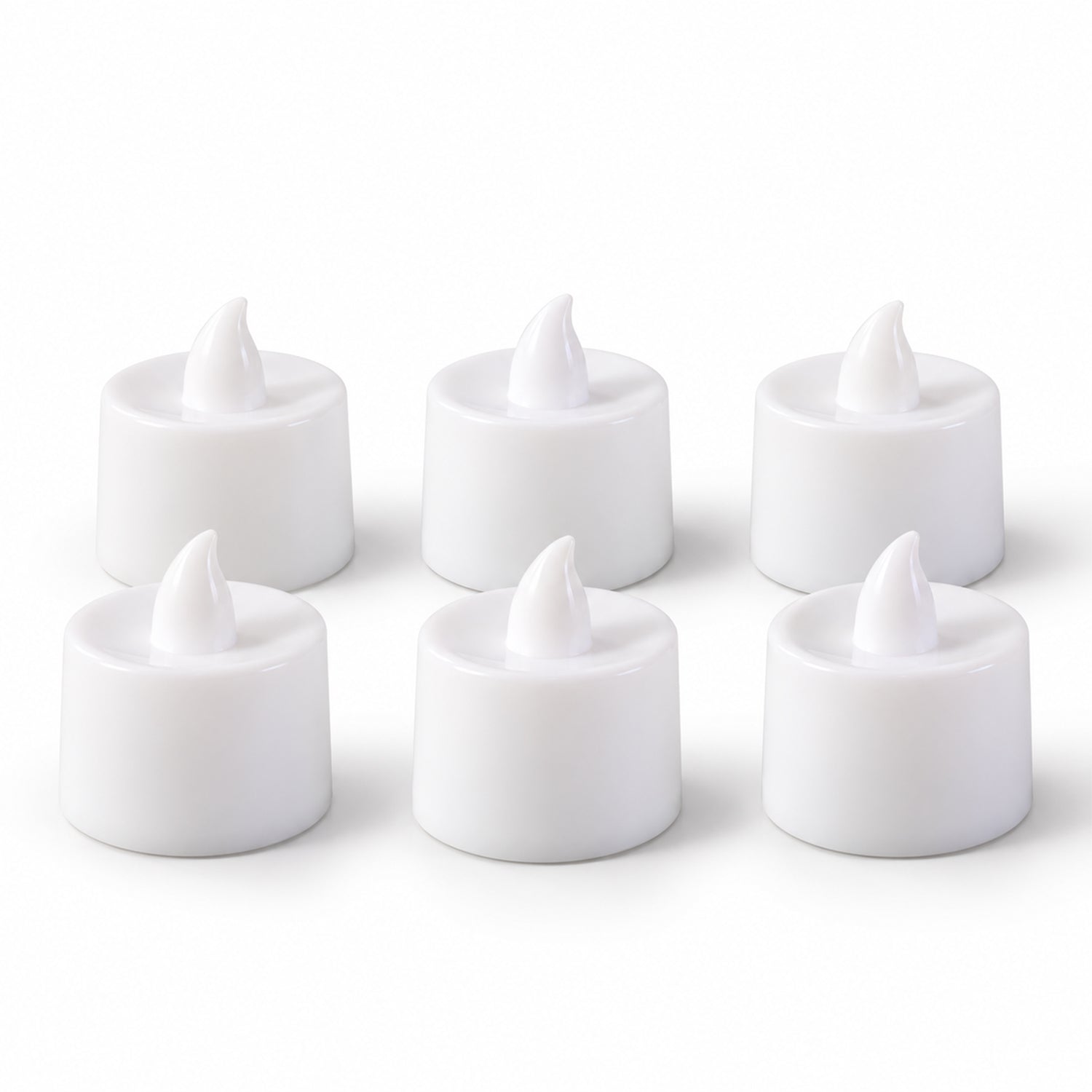 Six white flameless tealight candles with realistic flame-shaped tops are neatly arranged in two rows on a plain white