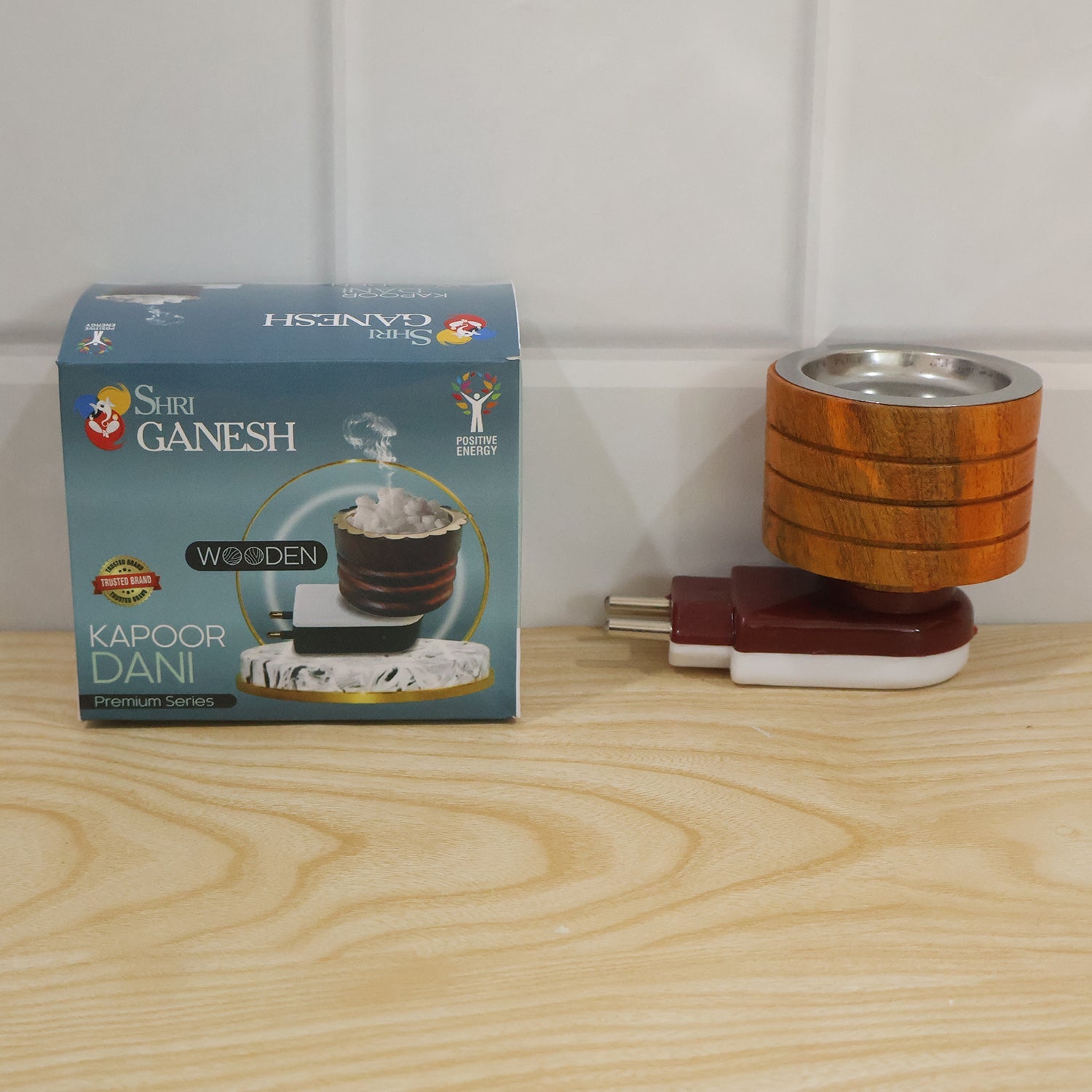 Electric wooden camphor diffuser in use for pooja ceremony
