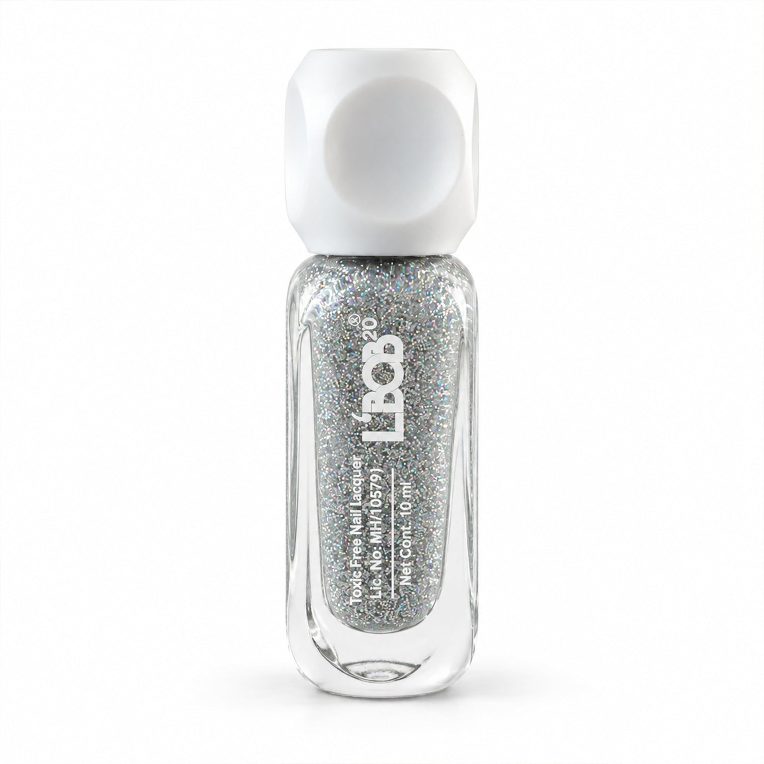 A clear bottle of silver glitter nail polish with a white, geometric cap stands upright on a white background.