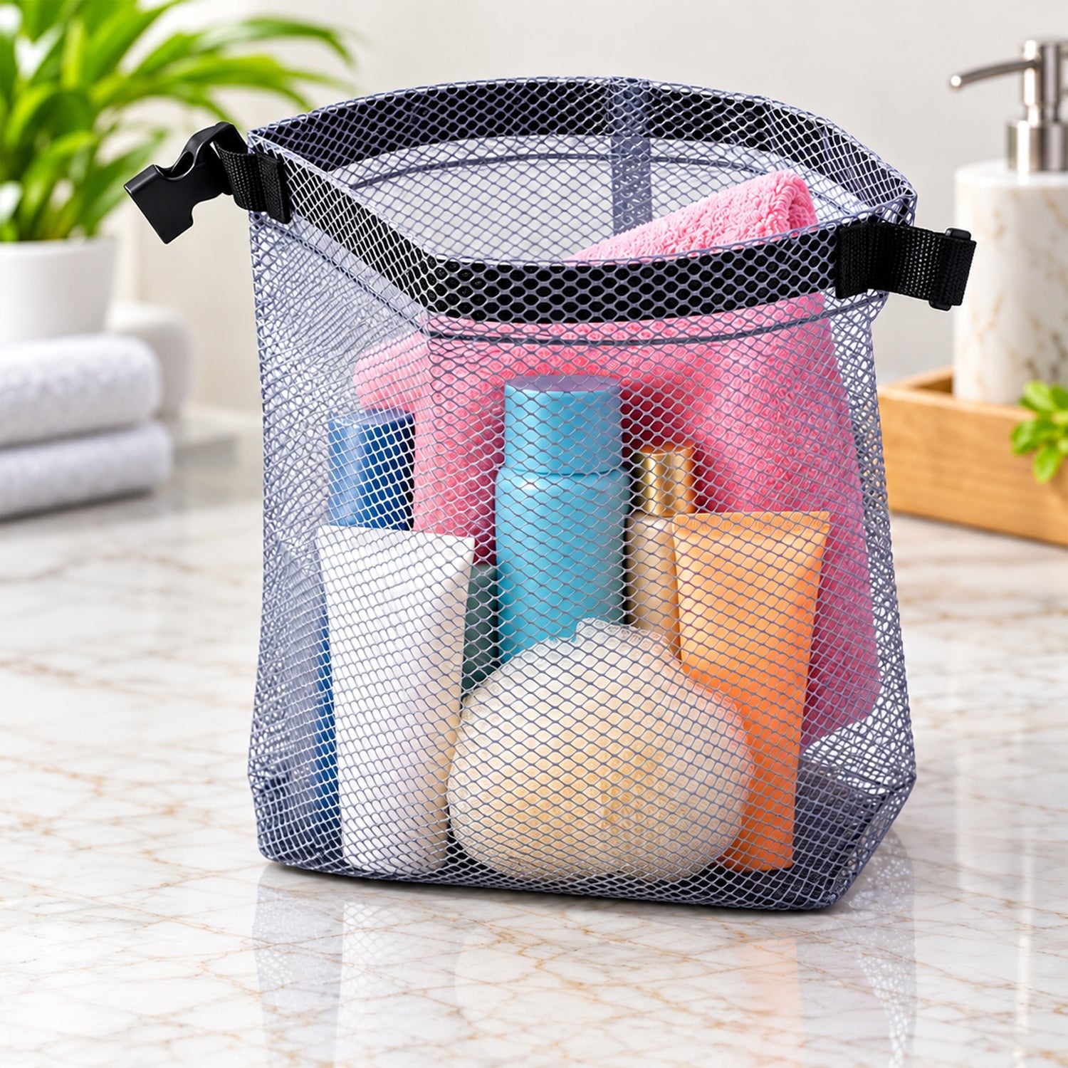 A grey mesh pouch filled with various colorful toiletries sits on a marble counter.