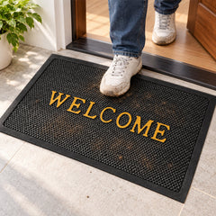 Close up of the textured mesh surface of the door mat