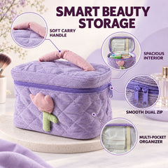 A lavender quilted corduroy cosmetic bag with a pink and green tulip applique, highlighting its soft carry handle, spacious