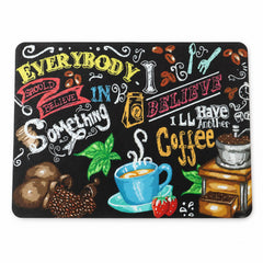 Close-up of the rectangular black mat featuring various coffee-related drawings and phrases in bright colors.