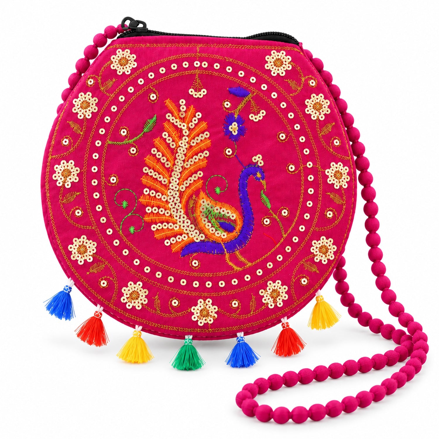 A fuchsia round purse with a beaded strap, detailed peacock embroidery, and bright tassels on a white background.