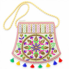 Front view of the embroidered jute sling purse with a beaded strap and colorful tassels on a white background.