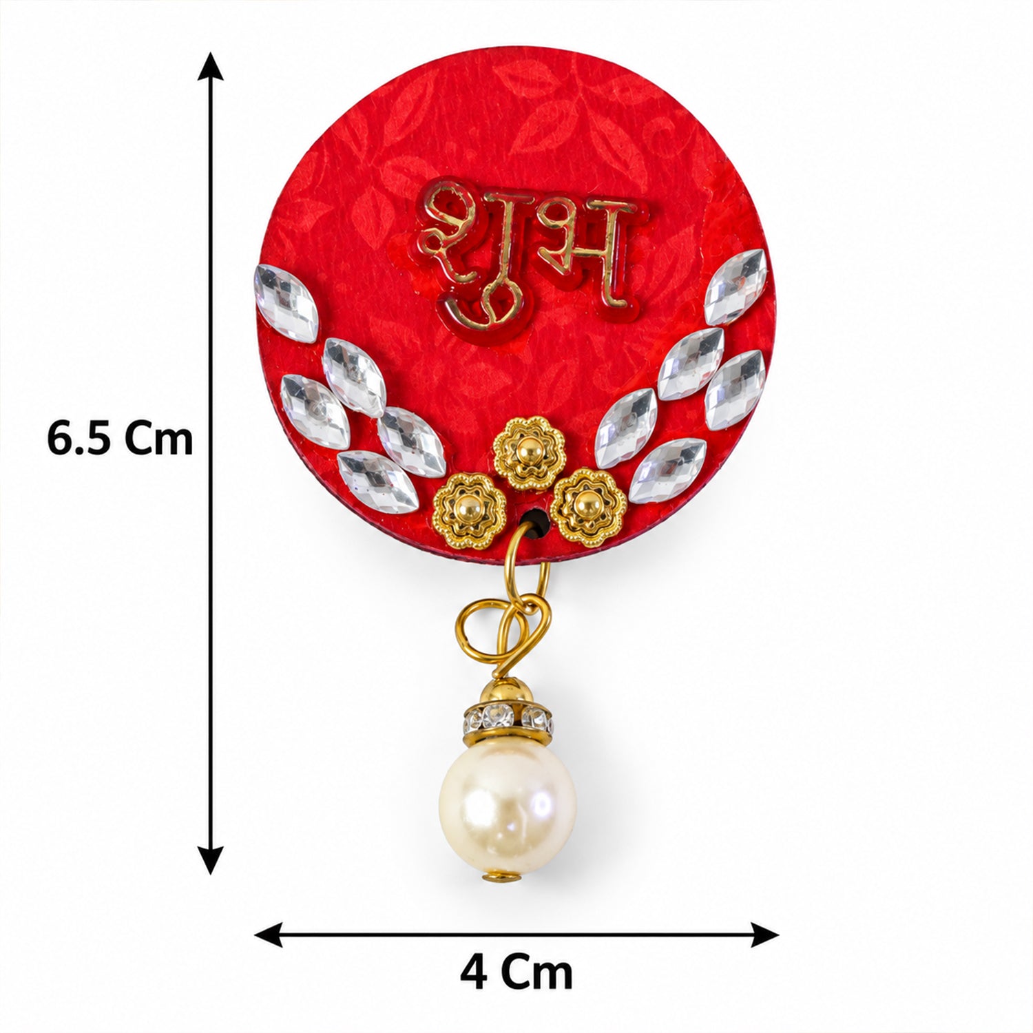 A single red circular Shubh decoration with gold script, silver diamante, and a pearl drop, with measurements of 6.5 cm by 4