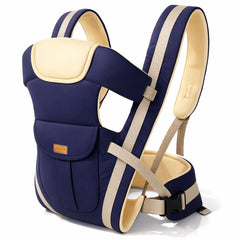 A navy blue baby carrier with beige straps and a padded head support is displayed on a white background.