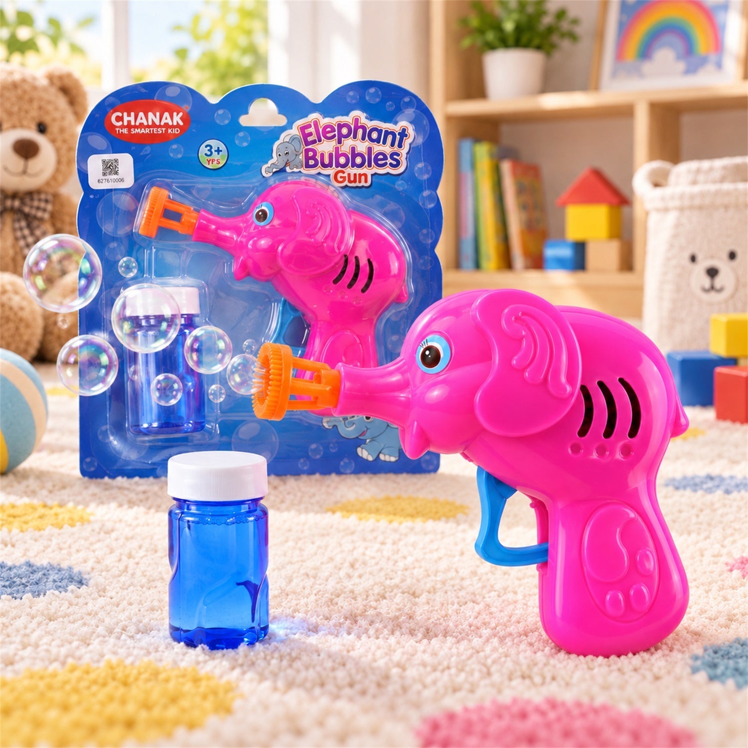 A pink elephant-shaped bubble gun and a blue solution bottle sit on a colorful rug, with bubbles floating around.
