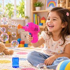 A smiling child sits on a rug, holding a pink elephant bubble gun that produces many bubbles.