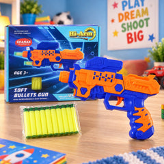 An orange and blue toy gun with a box of soft bullets on a wooden table, next to its packaging.