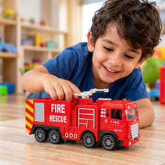 A child's hands playing with a red plastic fire truck toy on a wooden floor, smiling at the camera.