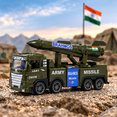A green toy army truck with a missile launcher on its back sits on a dirt road under a blue sky with an Indian flag.