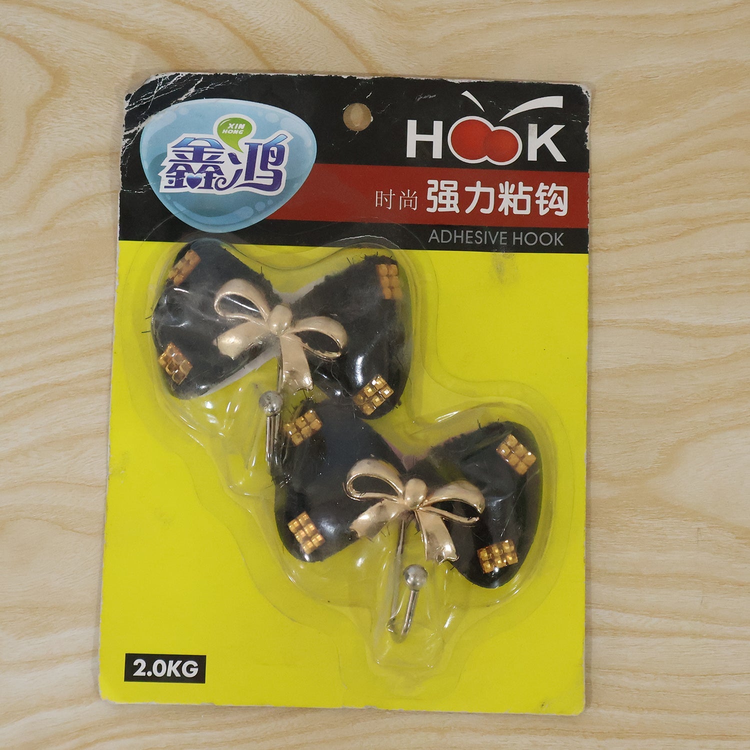Decorative bow adhesive hook in a home entryway setting