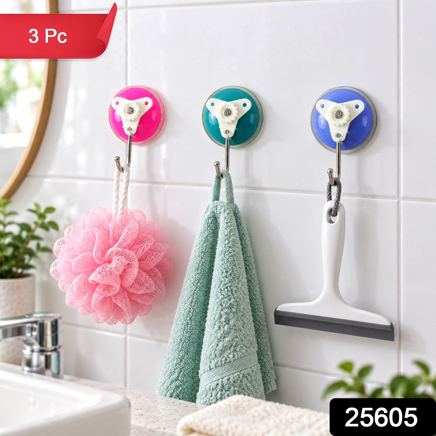 Three colorful suction cup hooks on a tiled wall, with a pink loofah, green towel, and white squeegee, and a red "3 Pc"
