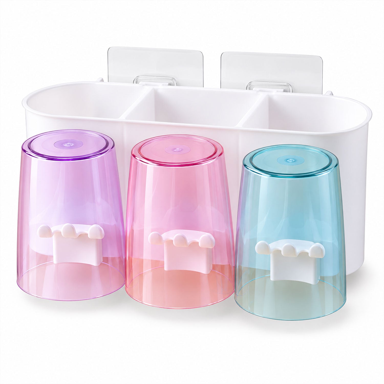 White oval organizer with three translucent cups in purple, pink, and blue, each with a white toothbrush holder attachment.