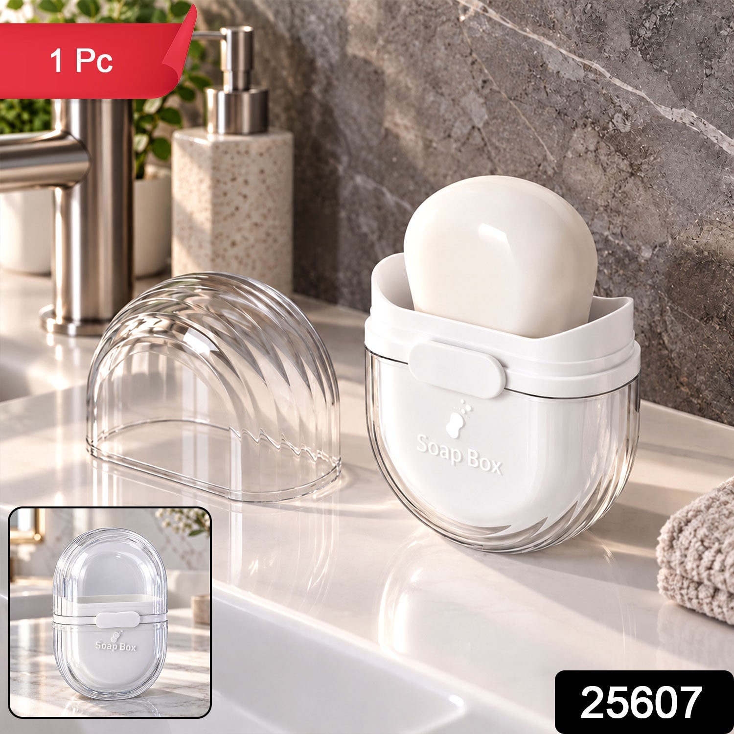 A clear and white oval soap box with a bar of soap inside, displayed open on a bathroom counter. The clear lid is â€“ view 2