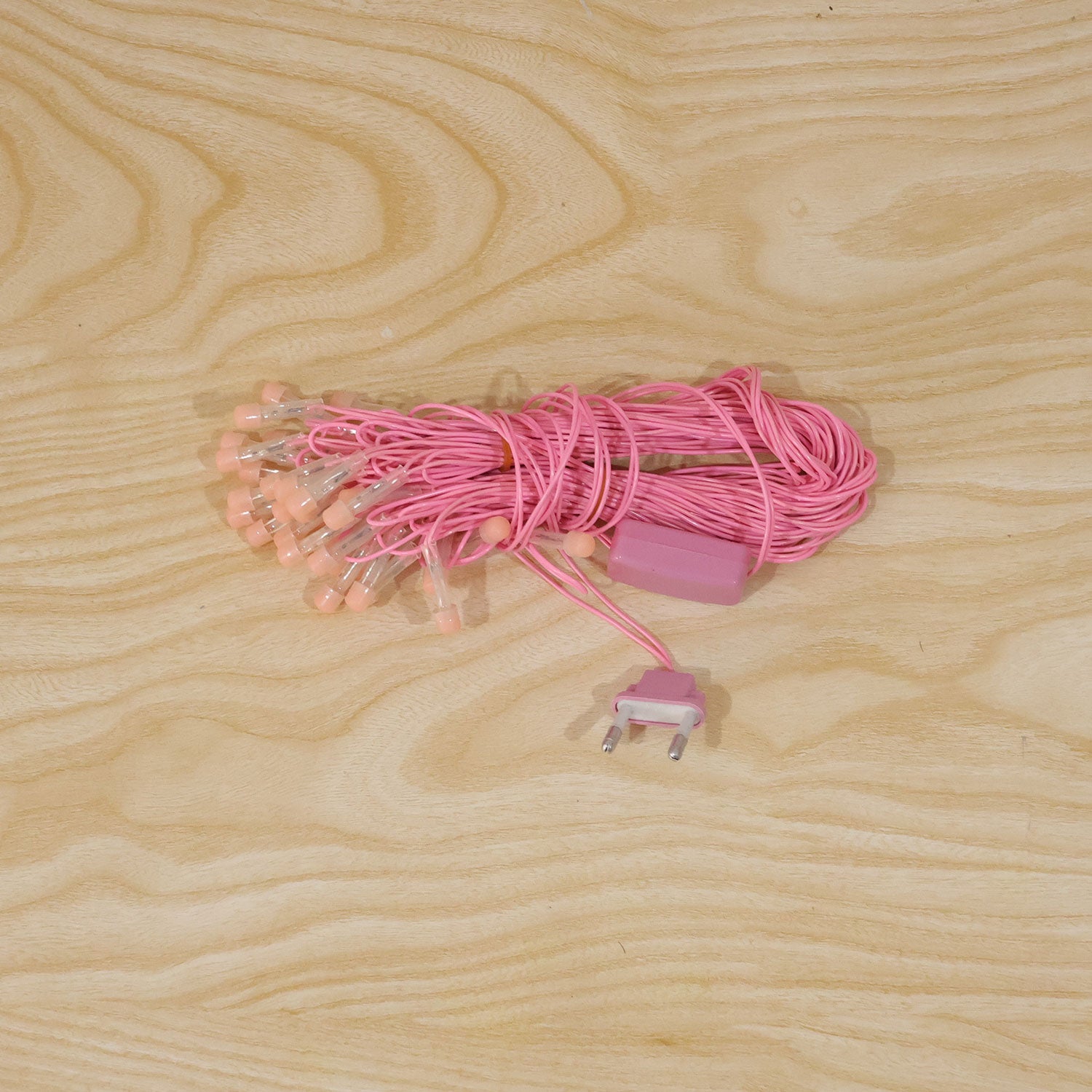Pink LED curtain string lights used for home decor