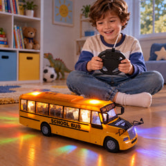 A smiling child plays with a bright yellow school bus toy that emits colorful lights on a wooden floor.